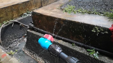 HDPE 1-inch black pipe leaked Stock Footage 97806352