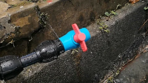 HDPE 1-inch black pipe leaked Stock Footage 97809463