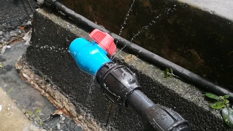 HDPE 1-inch black pipe leaked Stock Footage 97809486