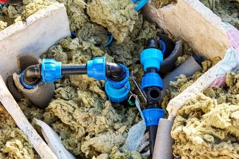 HDPE piping in artesian well pit during renovation. Stock Photos