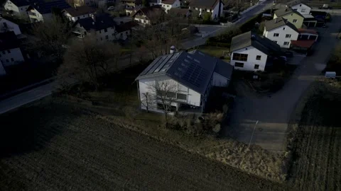 HDR Aerial View of House with Solar Panels in Bavarian City - Flying up 10Bit Video stock 177473953