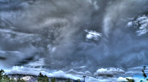 HDR Clouds Over a Mountain Stock Footage 836401