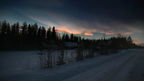 HDR image of nacreous clouds over Swedish farm buildings in winter Stock Photos