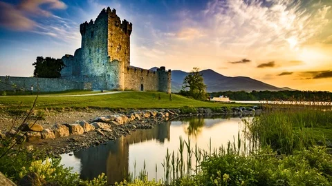 HDR Landscape time lapse of a sunset at a lake and old castle with orange clouds Video stock 83729729