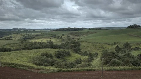 HDR Timelapse of clouds passing by in a rural landscape 4K Stock Footage 90277827