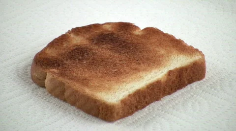 HDV: Buttering a Piece of Toast Stock Footage 95146