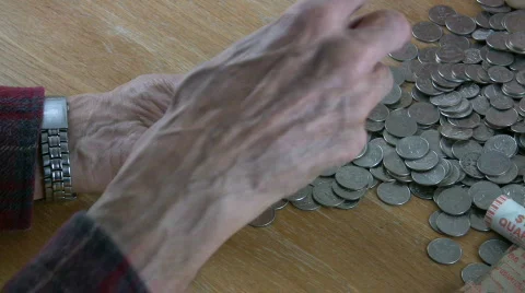 HDV: Man Folding Quarter Roll Stock Footage 101154