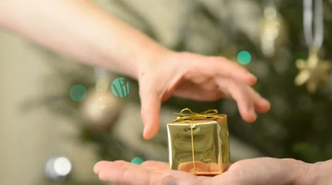 He and she make Christmas gifts to one another Stock Footage 33731297