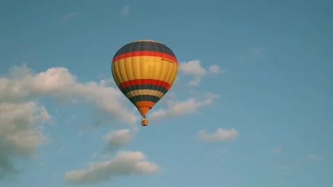 He balloon is flying low over the ground, the balloon is flying over the forest Stock Footage 208342429