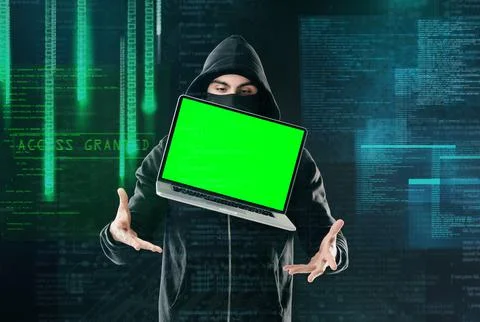 He can make your computer do his bidding. a computer hacker levitating a laptop Stock Photos