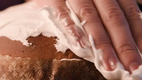 He chef spreads icing on the Easter cake. The glaze is white. Very beautiful Video stock 150400254