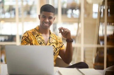 He develops so many amazing ideas all on his own. Shot of a young businessman Stock Photos