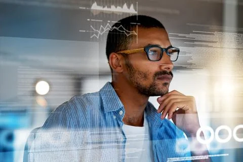 He doesnt stop until the job is done. a serious computer programmer working on Stockfoto's