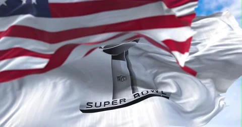 He flag with the Super Bowl logo waving in the wind with the US national flag Stock Footage 169954070