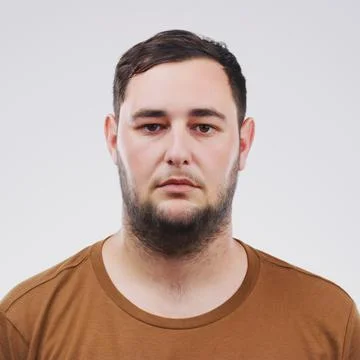 He gives nothing away. Studio portrait of a handsome young man posing Stock Photos