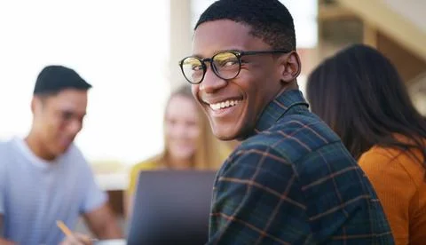 He has a bit of extra happy today. Portrait of a cheerful young student smiling Stock Photos