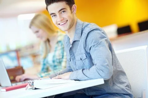He has his future planned out. Attractive male student with his study buddy in Stock Photos