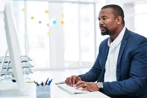 He holds a daily commitment to doing well. a mature businessman working on a Stock Photos