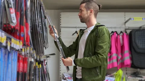 He needs new windscreen wipers for the car Stock Footage 142971066
