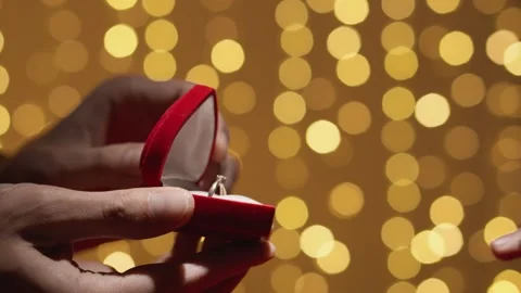 He opens the box and gives the wedding ring, she confidently stretches out her Stock Footage 242503158