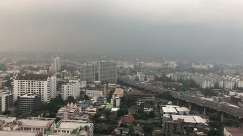 He pan shot of Smog hangs over the central of Bangkok, Thailand Video stock 101209612