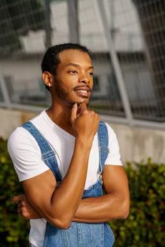 He is posing with hand under his chin Stock Photos