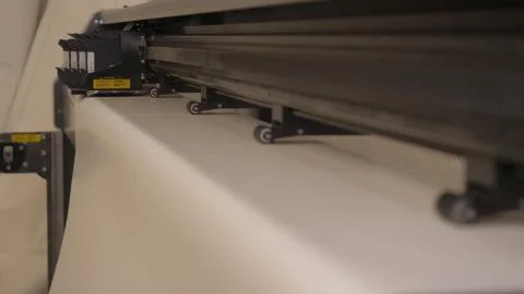 He printing machine prints the code on the paper (fabric) date, time code Foto stock