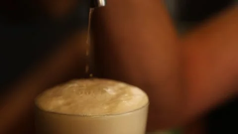 He is puring beer into the glass 2 Stock Footage 317912800