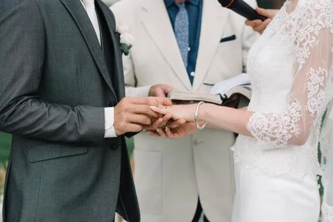 He Put the Wedding Ring on Her, wed ceremony Stock Photos
