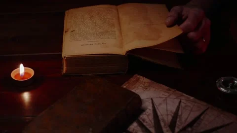 He is reading an old book Stock Footage 195442553