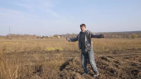 He Shouts, Throwing Dry Grass into The Air. A Flash Of Anger. Annoyance, Disappo Stock Footage 151386758