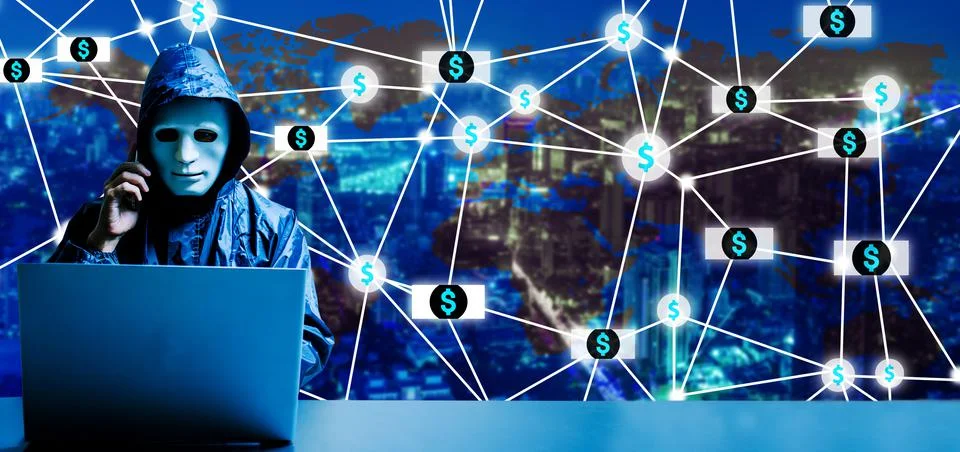 He using laptop computer for cyber attack and talking to victims thru smartphone Stock Photos