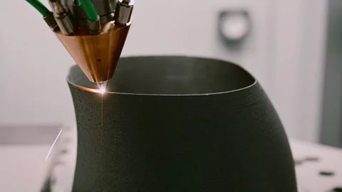 Head of 3D printer feeds hot metal dust making detail Stock Footage 249881574