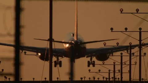 Head-On Airliner Descent Through LAX Approach Lights at Golden Hour Stock Footage 297844265