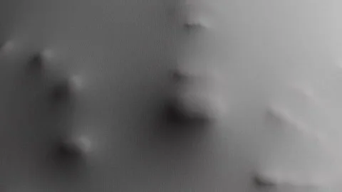 Head and hands pushing into spandex material to form an upper body impression Stock-Footage 259722976