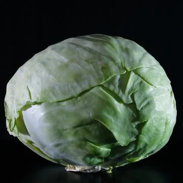 Head of cabbage close-up on a black background Stock Photos