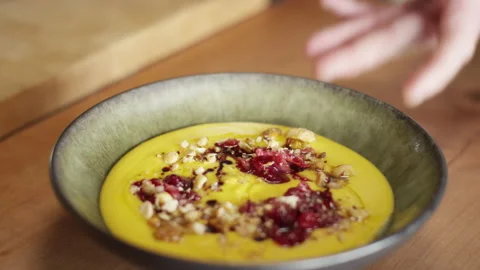 The head chef sets down a beautiful finished soup dish Video stock 153335141