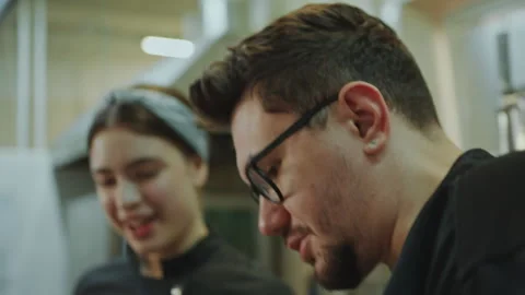 Head Chef Talking with Female Apprentice in Restaurant Kitchen 스톡 동영상 270140521