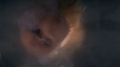 Head doll to cook in boiling liquid for a ritual 스톡 동영상 82235097