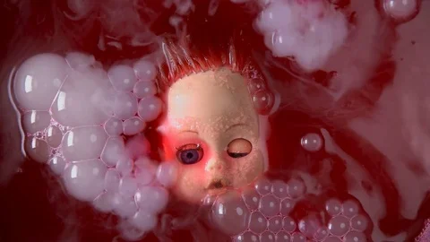 Head doll to cook in boiling liquid for a ritual 스톡 동영상 82246641