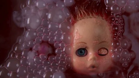 Head doll to cook in boiling liquid for a ritual 스톡 동영상 82246692