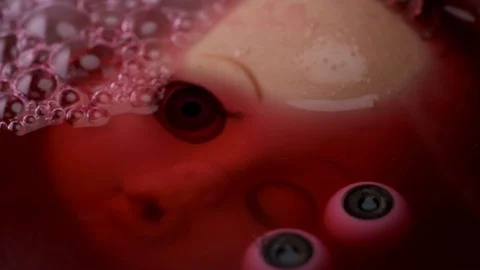 Head doll to cook in boiling liquid for a ritual 스톡 동영상 82247872