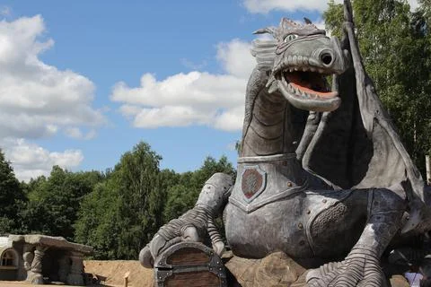 The head of a dragon against the sky. Fragment of the nose of a medieval Viking Stock Photos