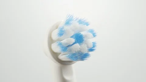Head of an electric toothbrush macro rotating on and off side view Stock-Footage 108216228