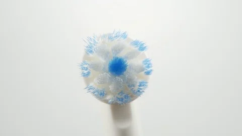 Head of an electric toothbrush macro rotating on and off 스톡 동영상 108216267