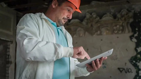 A Head Is Examining Drafts On The Tablet 1 Stock Footage 30441661