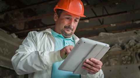 A Head Is Examining Drafts On The Tablet 2 Video stock 30441721