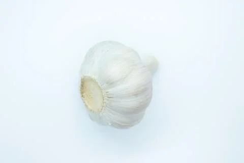 The head of garlic is located on a white background Foto stock