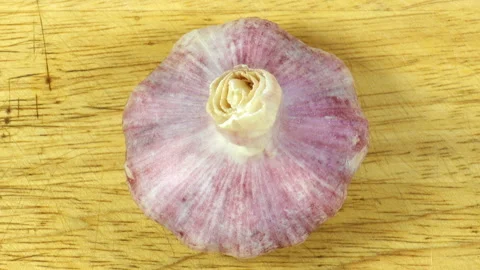 Head of garlic on a wooden surface. Stock Footage 133264947