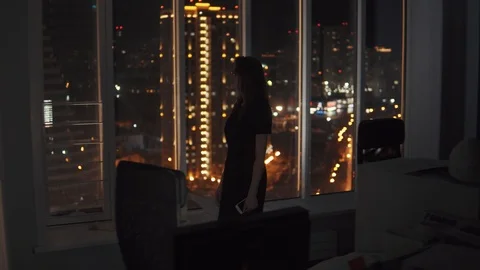 The head goes to an empty dark office after the work day. Portrait of a business Stock Footage 105808942